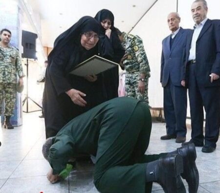 Iraqi Man Kisses the Foot of an Iranian Cleric