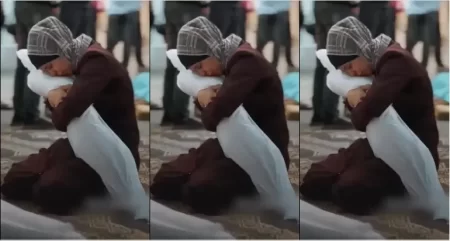 A Palestinian mother kisses the body of her child after he was martyred in an occupation raid
