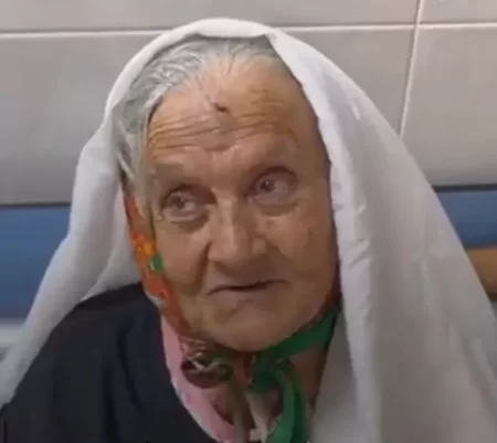 An elderly Palestinian woman born in 1944, which is before the existence of Israel.