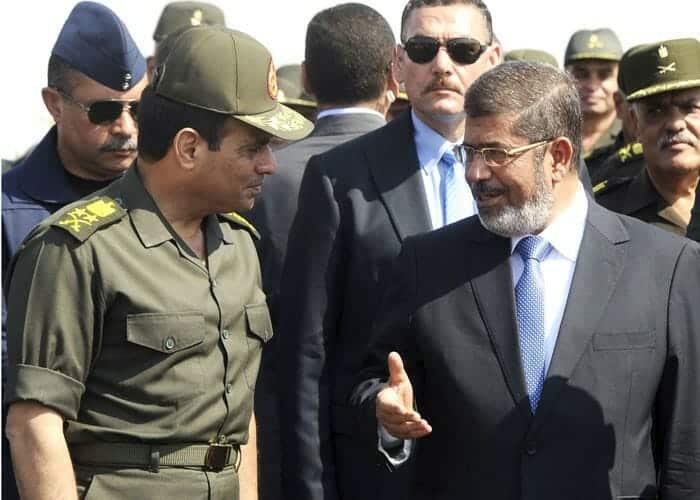 مرسي والسيسي watanserb.com