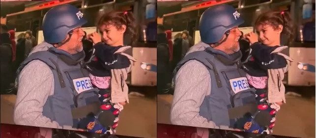 طفلة فلسطينية مع مراسل الجزيرة وائل الدحدوح أثناء التغطية