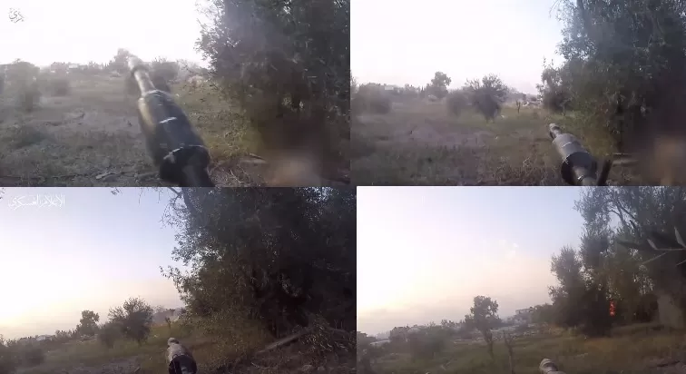 مقاتلو القسام يوجهون أسلحتهم أثناء استهدافهم آلية الاحتلال