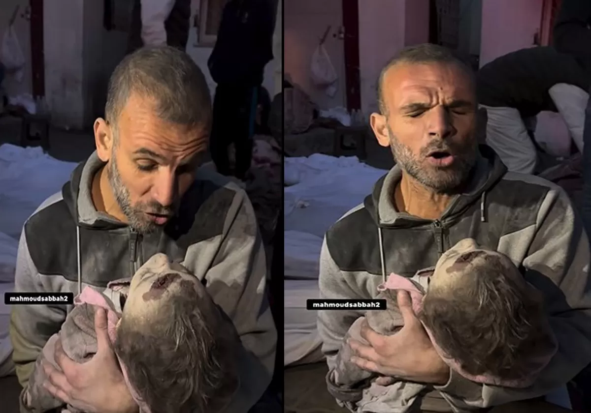 وداع والد فلسطيني لطفلته الشهيدة بقصف الاحتلال على غزة