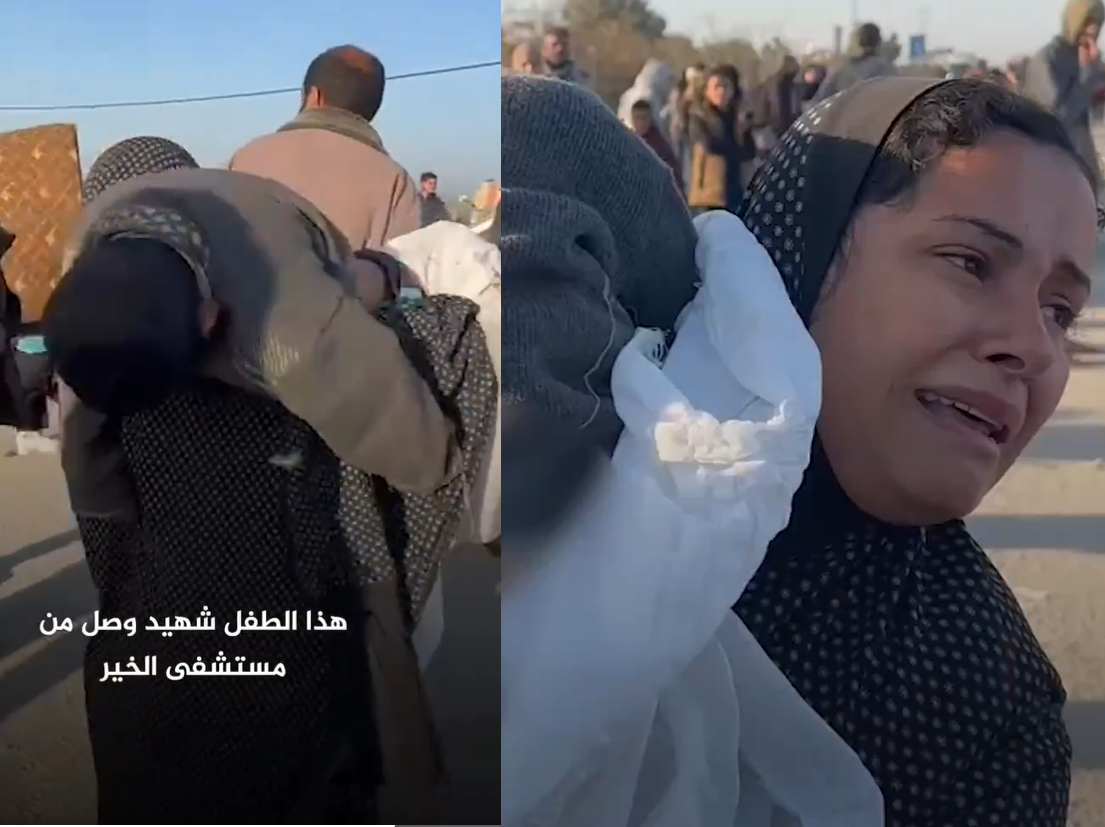 سيدة تحمل جثة ابنها الشهيد أثناء هروبها من القصف